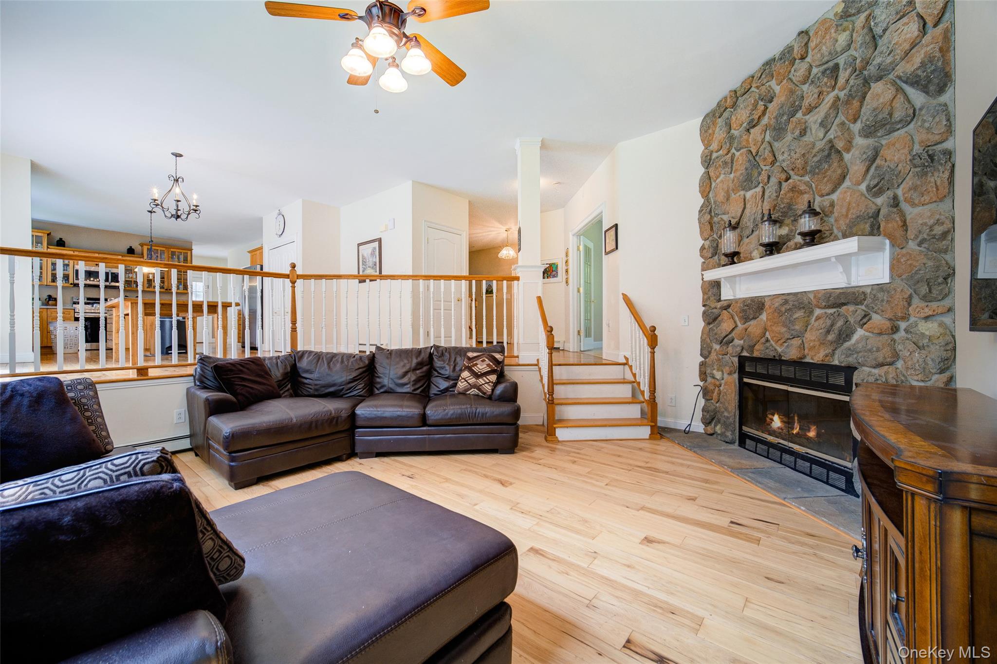 221 Rabbit Run Road Clintondale, NY 12515 - Photo 16 of 50 a living room with furniture a fireplace and a flat screen tv