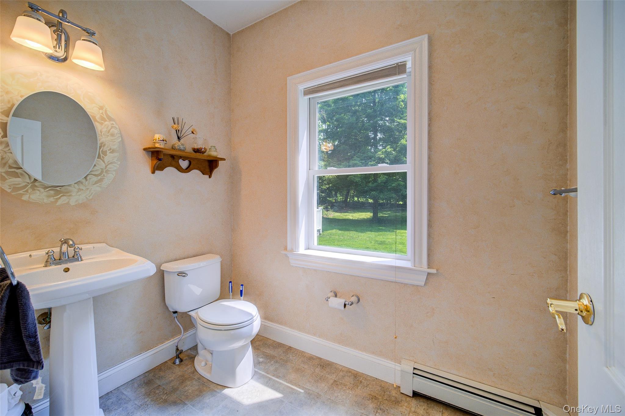 221 Rabbit Run Road Clintondale, NY 12515 - Photo 22 of 50 a bathroom with a toilet a sink and mirror