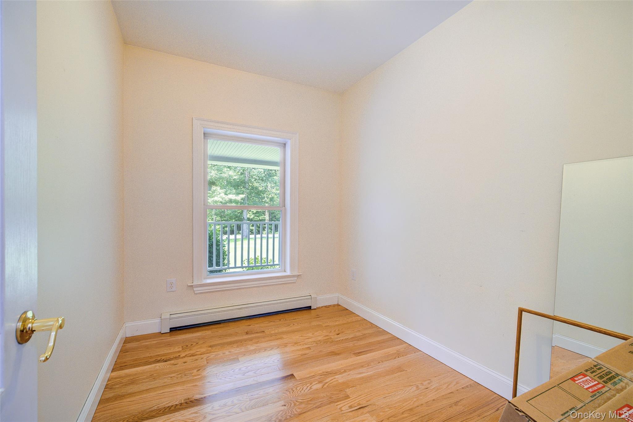 221 Rabbit Run Road Clintondale, NY 12515 - Photo 23 of 50 a view of an empty room with wooden floor and a window