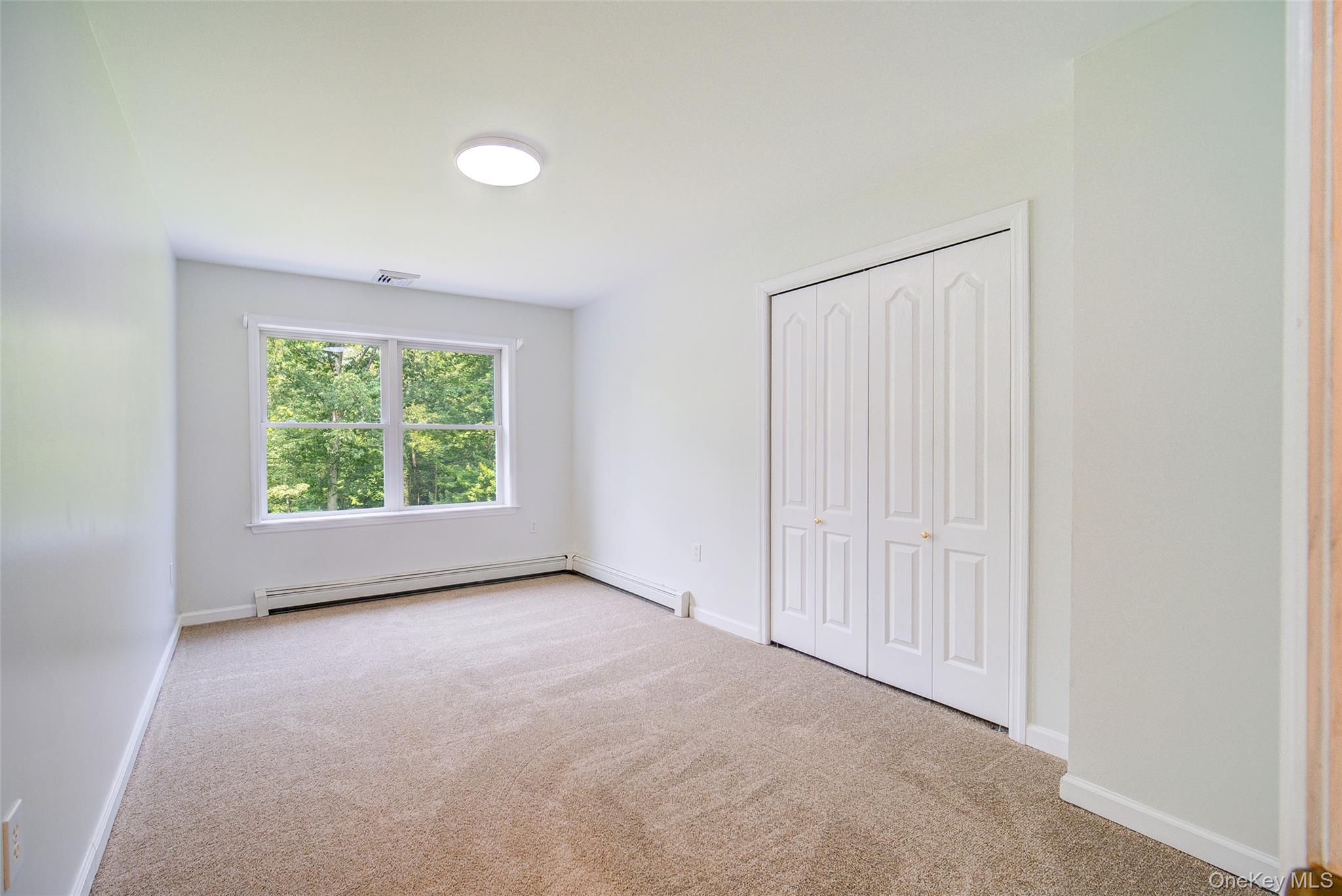221 Rabbit Run Road Clintondale, NY 12515 - Photo 32 of 50 an empty room with windows and view