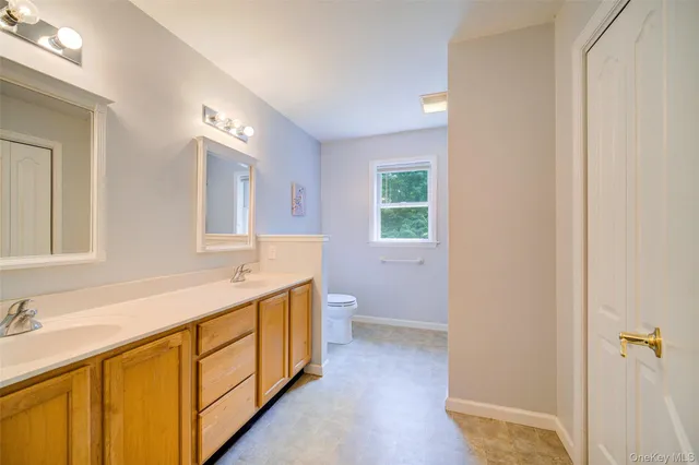 a bathroom with a toilet and a shower curtain