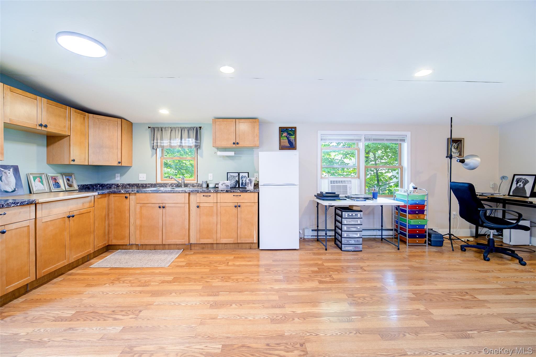 221 Rabbit Run Road Clintondale, NY 12515 - Photo 44 of 50 a large kitchen with stainless steel appliances granite countertop a stove a sink dishwasher and a refrigerator with wooden floor