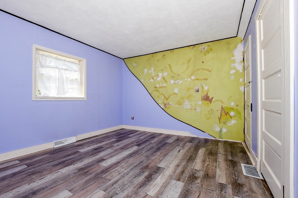 6 Gilbert Way Wareham, MA 02571 - Photo 28 of 41 a view of a big room with wooden floor and windows