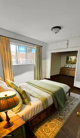 a bedroom with a bed and window