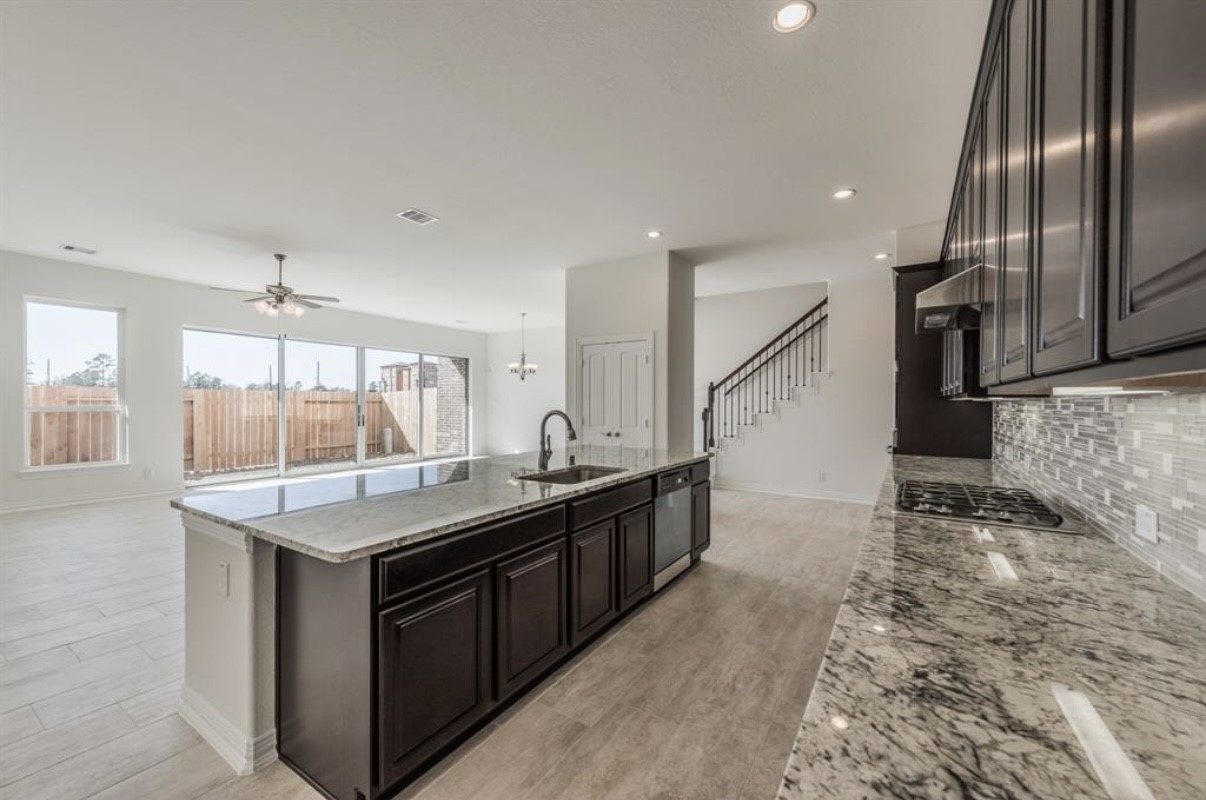3223 Harmony Creek Lane Spring, TX 77386 - Photo 15 of 34 a kitchen with stainless steel appliances granite countertop a sink and a stove