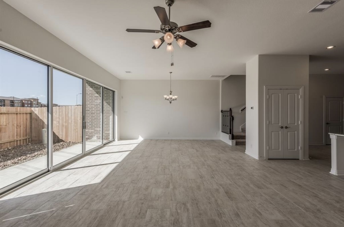 3223 Harmony Creek Lane Spring, TX 77386 - Photo 17 of 34 a view of empty room with wooden floor and fan