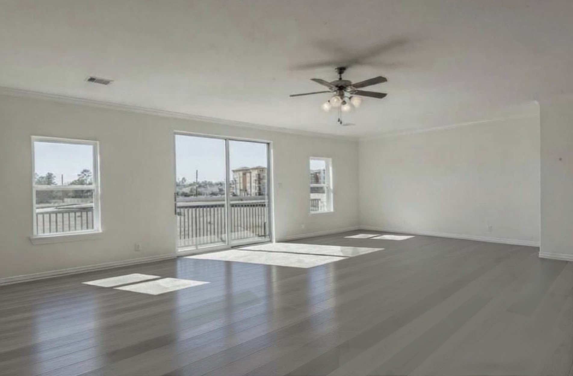 3223 Harmony Creek Lane Spring, TX 77386 - Photo 23 of 34 a view of an empty room with a window and wooden floor