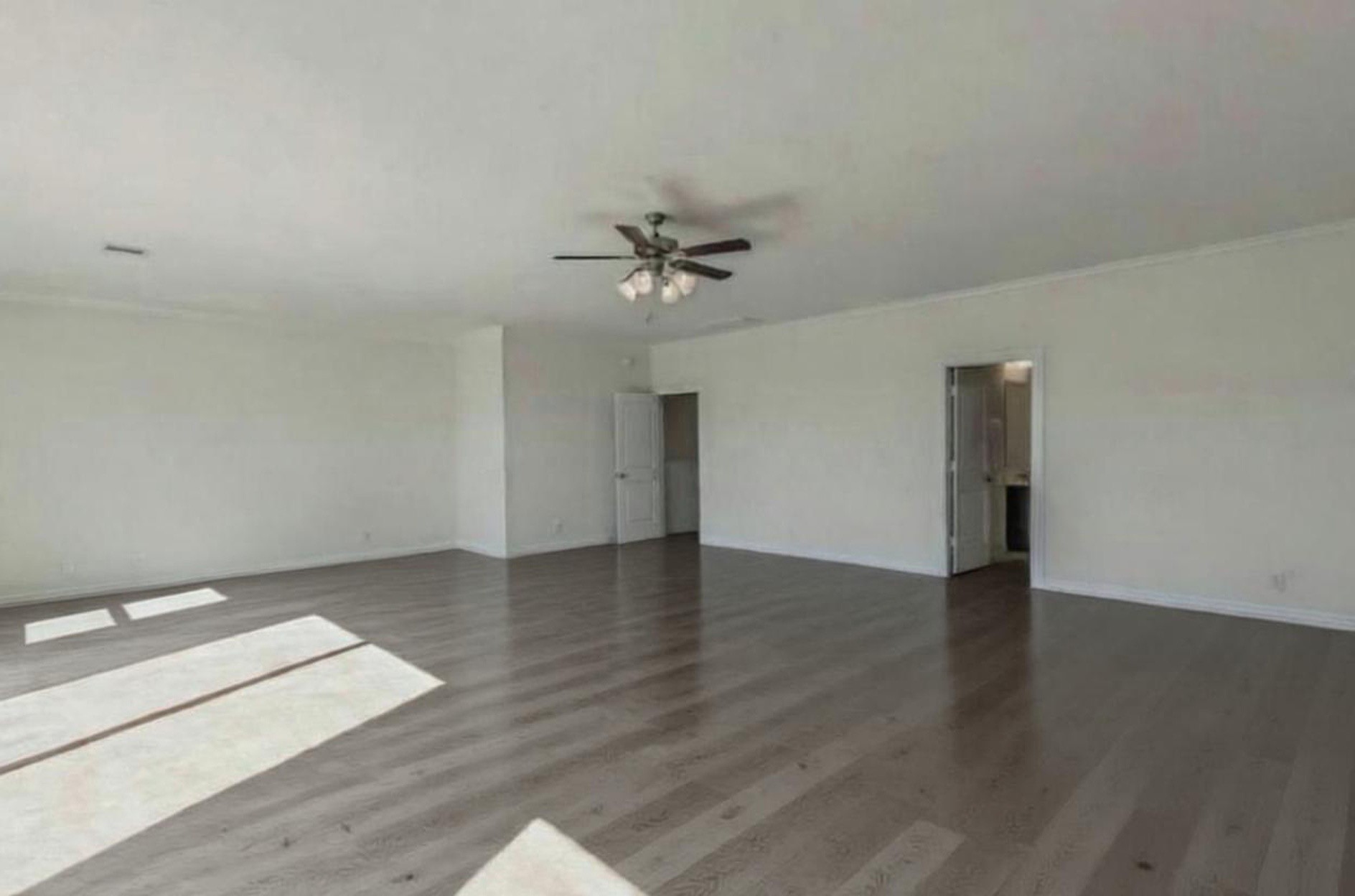 3223 Harmony Creek Lane Spring, TX 77386 - Photo 24 of 34 wooden floor in an empty room with a window