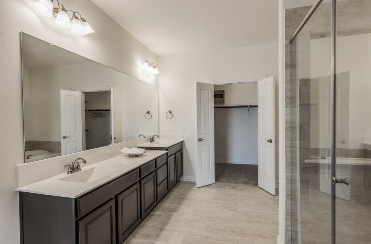 3223 Harmony Creek Lane Spring, TX 77386 - Photo 28 of 34 a bathroom with a double vanity sink mirror and shower