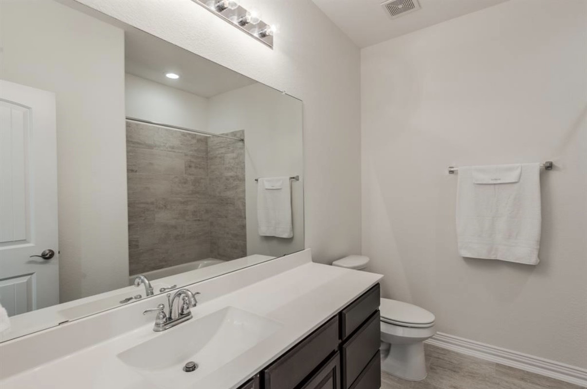 3223 Harmony Creek Lane Spring, TX 77386 - Photo 29 of 34 a bathroom with a sink toilet and vanity