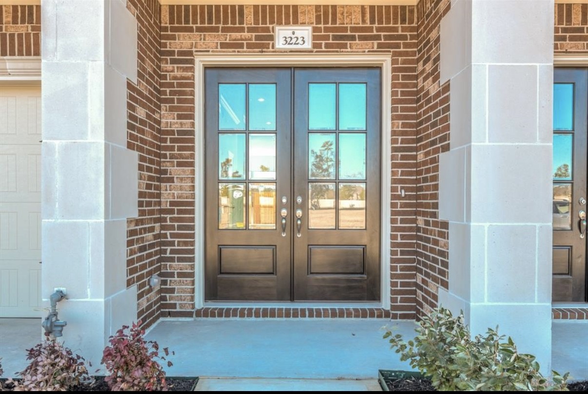 3223 Harmony Creek Lane Spring, TX 77386 - Photo 3 of 34 a view of a door of a house with a potted plant