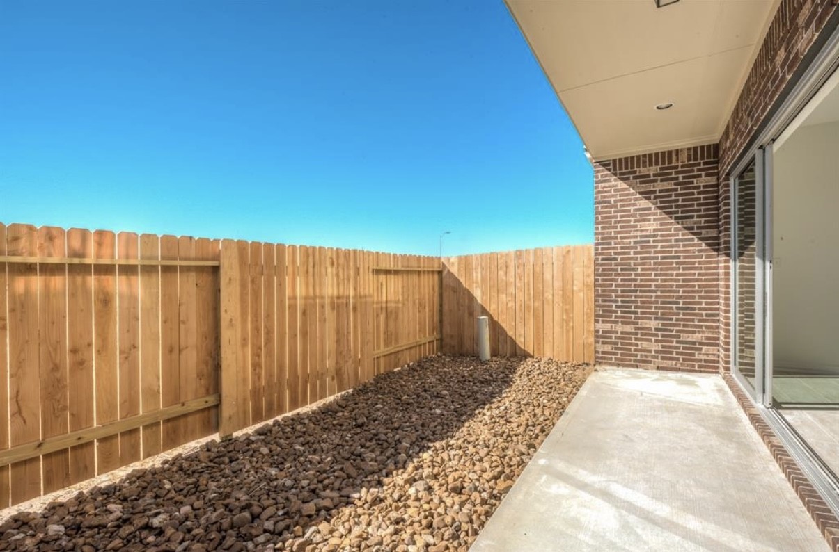 3223 Harmony Creek Lane Spring, TX 77386 - Photo 34 of 34 a view of a backyard with a small cabin