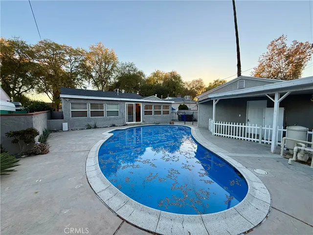 swimming pool view with a outdoor seating