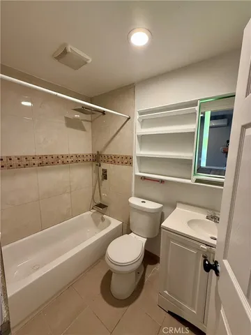 a bathroom with a toilet a sink and bathtub