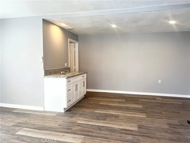 a view of cabinets and wooden floor