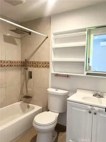 a bathroom with a toilet a sink and bathtub