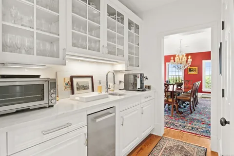 a kitchen with stainless steel appliances granite countertop a stove and a sink