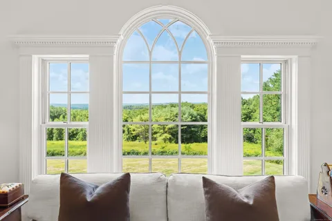 a bedroom with a bed and a fireplace