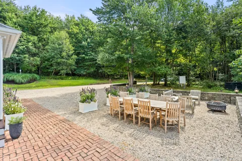 a view of a backyard of the house