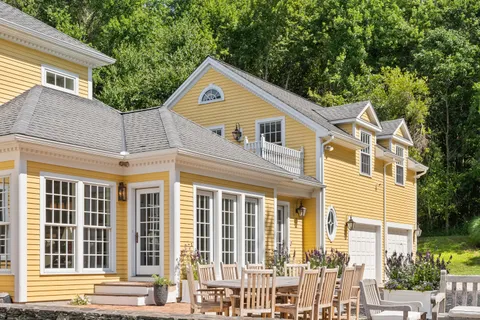 a front view of a house with a yard