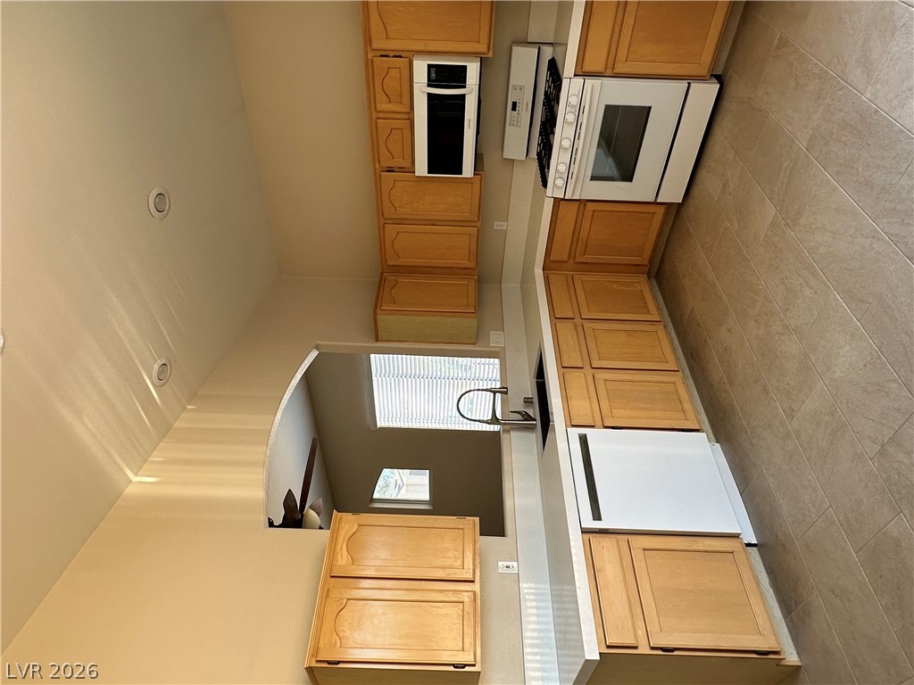 1922 Thunder Ridge Circle Henderson, NV 89012 - Photo 10 of 27 Culinary delights await in this well-appointed kitchen with abundant cabinetry.