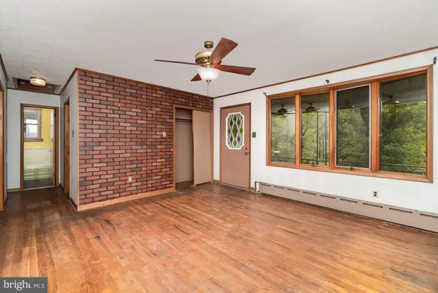 a view of an empty room with a window