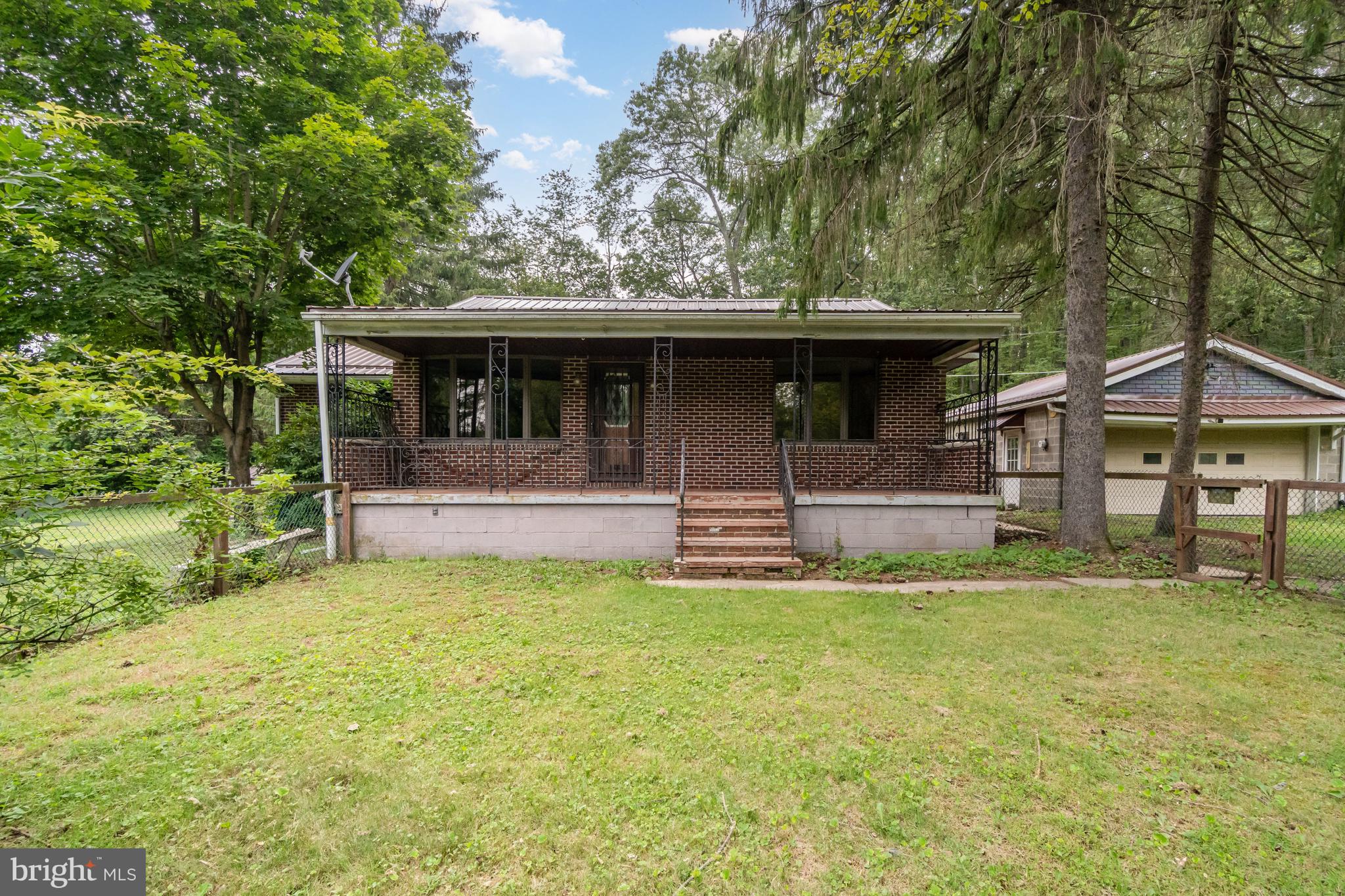 199 State Road Barnesville, PA 18214 - Photo 5 of 56 a front view of house with yard and trees in the background