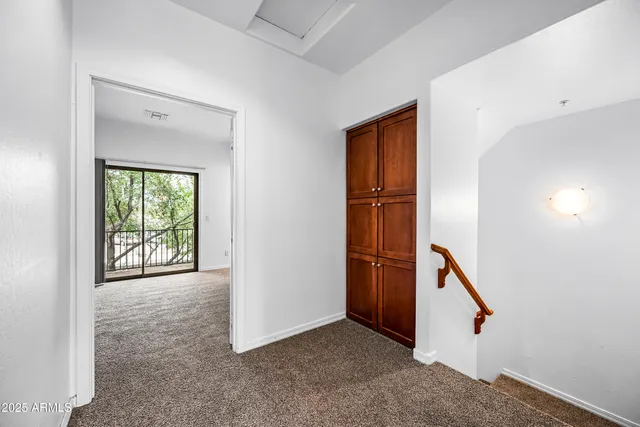 wooden floor and ceiling fan in a room