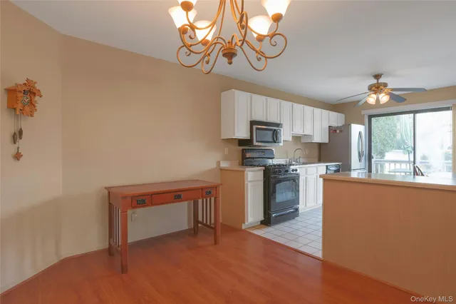a kitchen with cabinets a sink and appliances