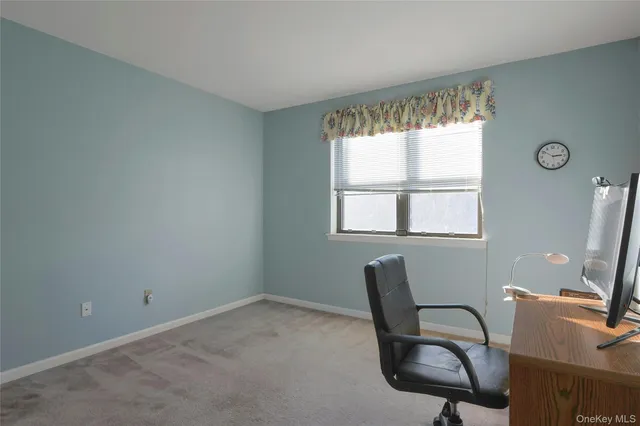 a workspace with furniture and a window