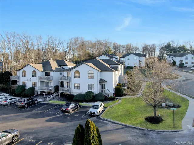 a view of a park with iron fence