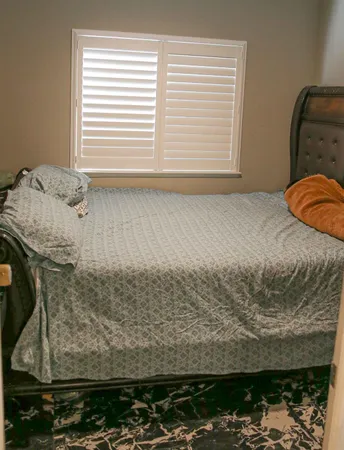 a picture of a bathroom with a sink and a mirror