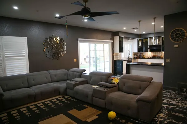 a living room with furniture and a fireplace
