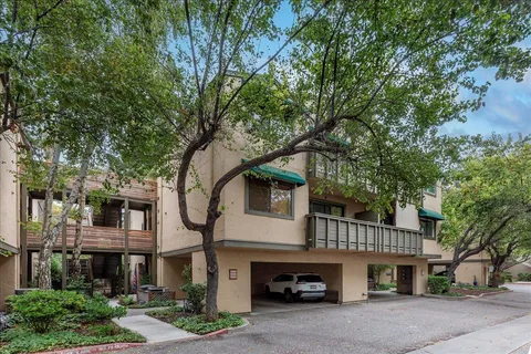 a front view of a house with a garage