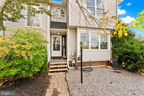 a house with a yard and outdoor seating