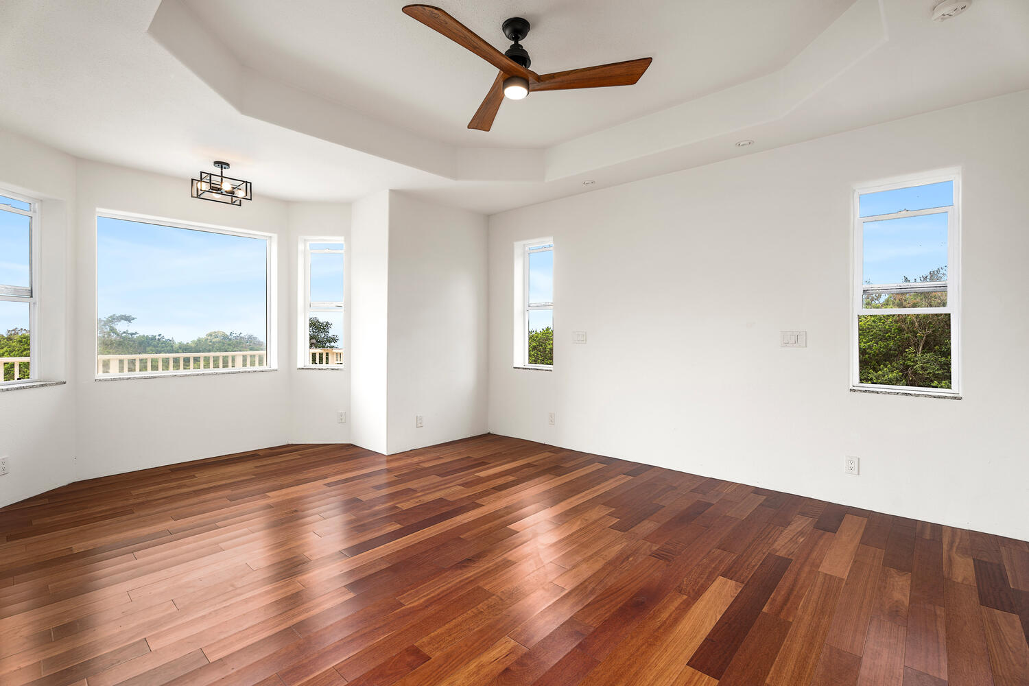 79-1145 Kao Road Holualoa, HI 96725 - Photo 14 of 30 a view of empty room with wooden floor and fan