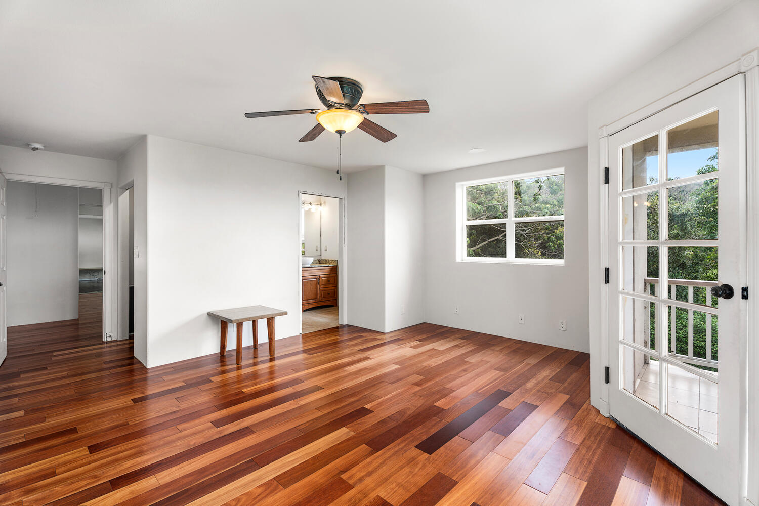 79-1145 Kao Road Holualoa, HI 96725 - Photo 22 of 30 a view of an empty room with a window and wooden floor