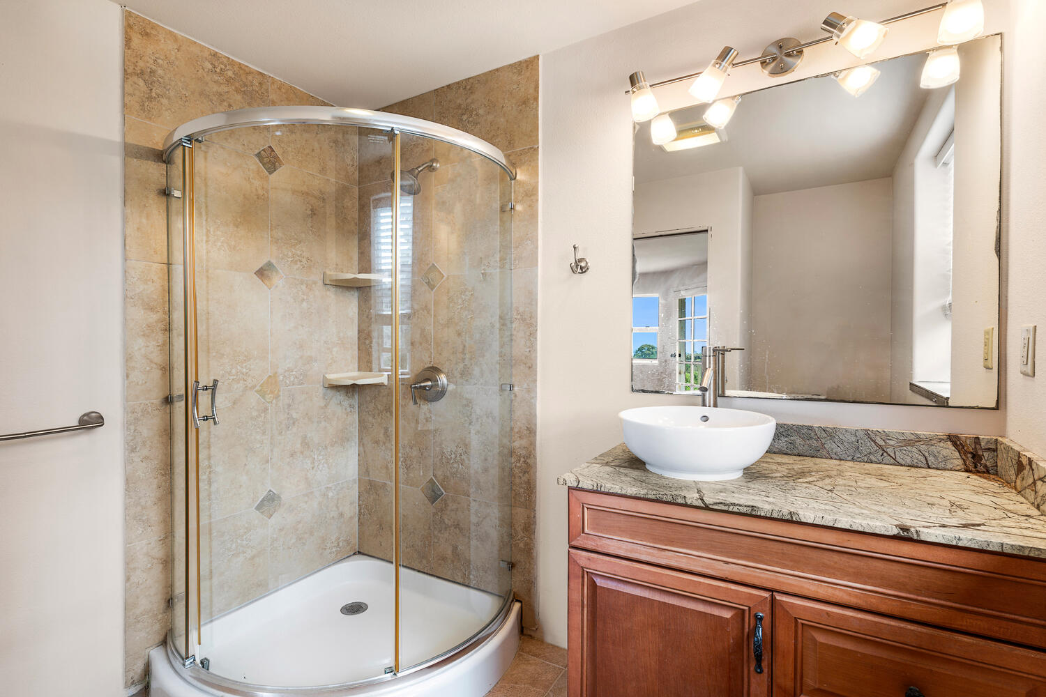 79-1145 Kao Road Holualoa, HI 96725 - Photo 23 of 30 a bathroom with a granite countertop sink toilet a shower and a mirror