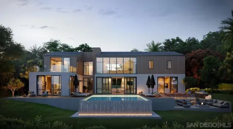 a front view of house and yard with green space