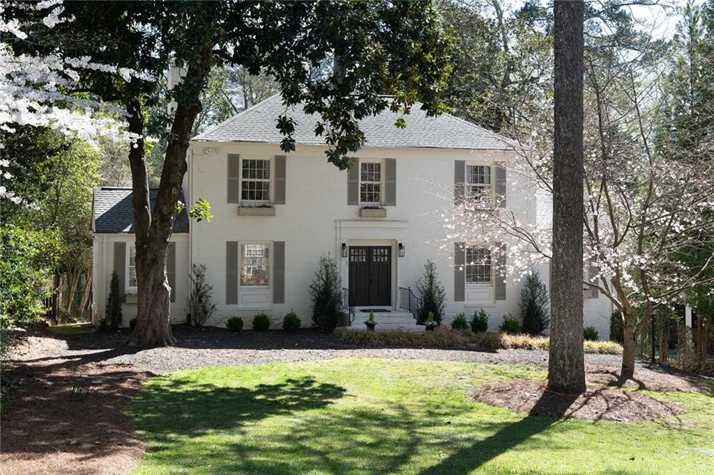 3315 Habersham Road Northwest Atlanta, GA 30305 - Photo 1 of 1 a front view of house with yard