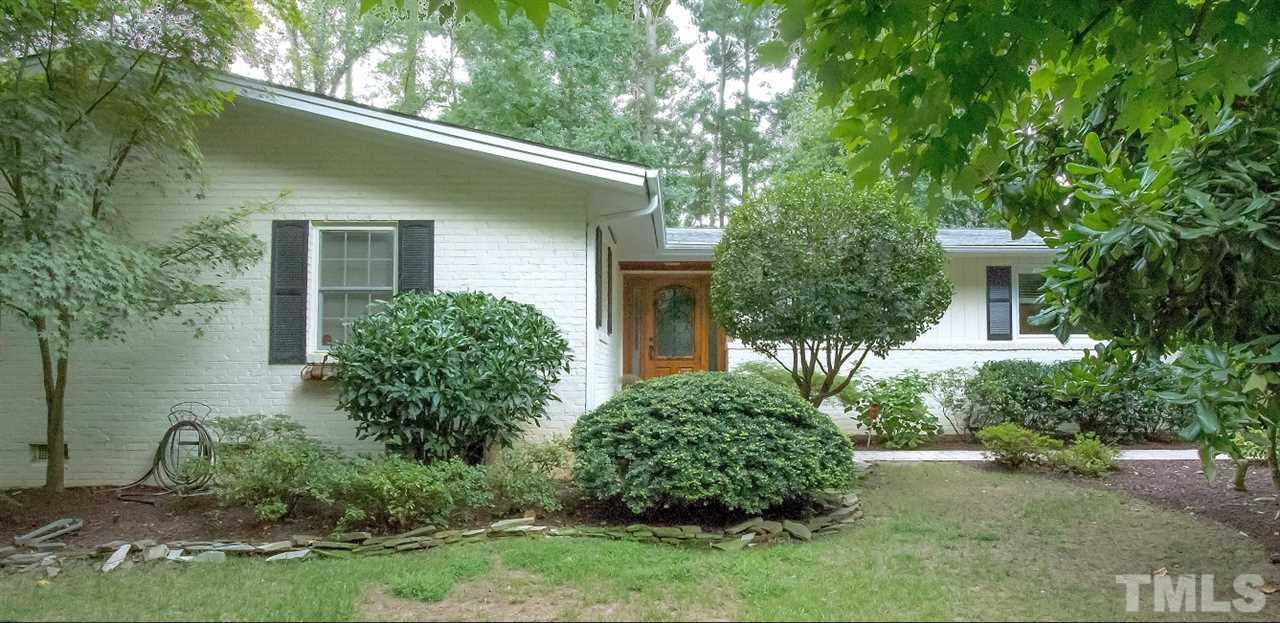 1205 Gunnison Place Raleigh, NC 27609 - Photo 1 of 14 a view of a house with a yard