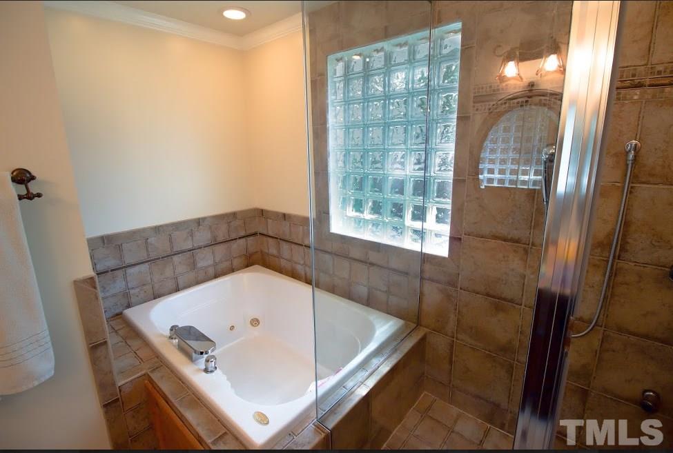 1205 Gunnison Place Raleigh, NC 27609 - Photo 11 of 14 a bathroom with a tub and shower