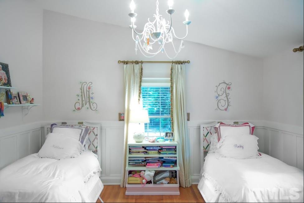 1205 Gunnison Place Raleigh, NC 27609 - Photo 13 of 14 a bedroom with a bed and a window