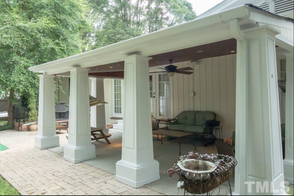 1205 Gunnison Place Raleigh, NC 27609 - Photo 3 of 14 a backyard of a house with outdoor seating