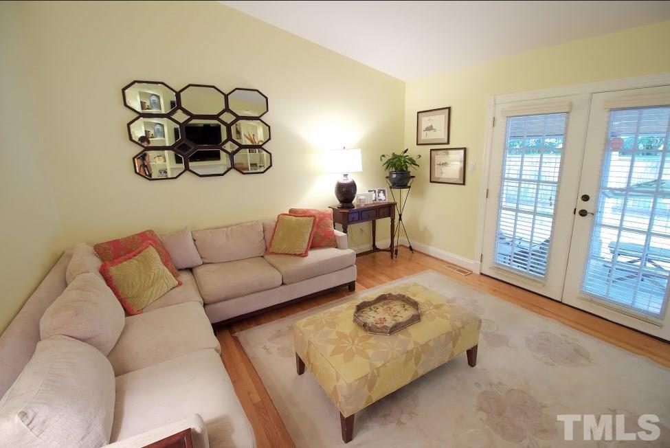 1205 Gunnison Place Raleigh, NC 27609 - Photo 5 of 14 a living room with furniture and a table