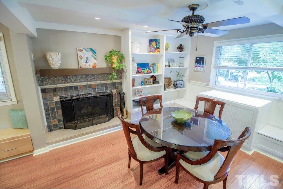 1205 Gunnison Place Raleigh, NC 27609 - Photo 8 of 14 a view of a dining room with furniture window and wooden floor