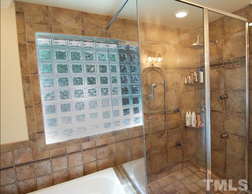 1205 Gunnison Place Raleigh, NC 27609 - Photo 10 of 14 a bathroom with a shower and a sink