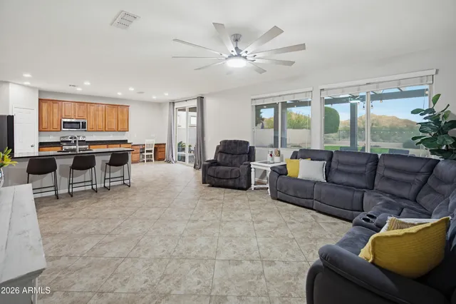 a spacious bathroom with a double vanity sink and mirror