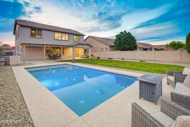 a view of a livingroom with furniture and a dining table