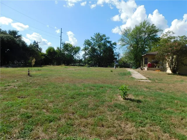 a view of a field with of trees